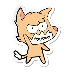 sticker of a cartoon grinning fox