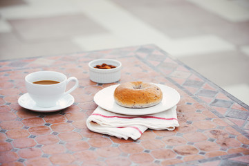 cup of coffee with bread on table in the morning with sunlight, breakfast