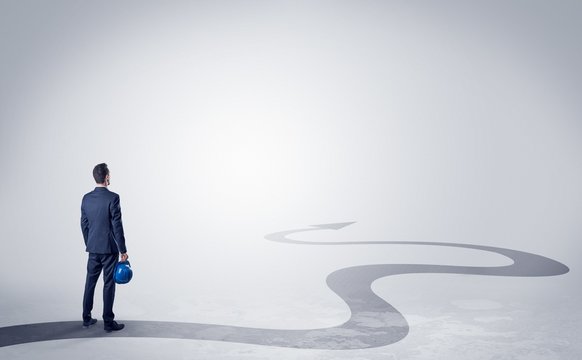 Man with object in his hand on the direct way to success