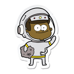 Obraz premium sticker of a happy astronaut cartoon