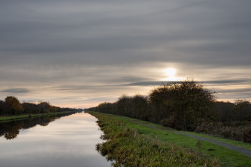 Fototapeta na wymiar Evening light over New Junction Canal and Transpenning Trail bridelway, near Doncaster, South Yorshire, UK