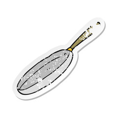 retro distressed sticker of a cartoon frying pan