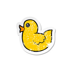 retro distressed sticker of a cartoon rubber duck