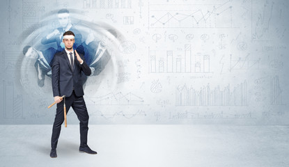 Obraz premium Young businessman in suit fighting with chart and report concept 