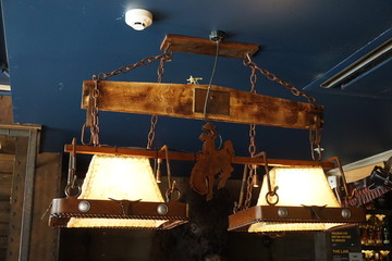 2 yellow and orange lamps covered by leather cowboys mental keychain  style vintage bar Western ...