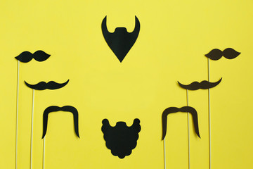 Happy Father's Day. image of a man on paper. Beard and mustache on yellow background. Concept of prostate cancer