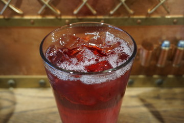 Beautiful delicious cranberry juice cocktail alcohol in glass with ice cube white foam jam jar beverage summer time in party lemonade gin tequila on wooden table ice cold glass  