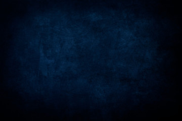 Dark blue grungy distressed canvas bacground