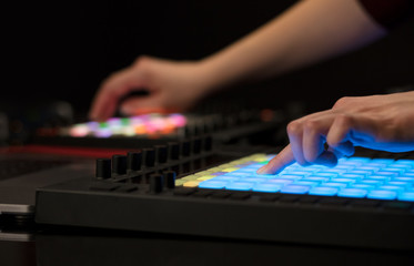 Fototapeta premium Dj hand remixing music on midi controller 