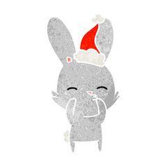 Fototapeta na wymiar curious bunny retro cartoon of a wearing santa hat