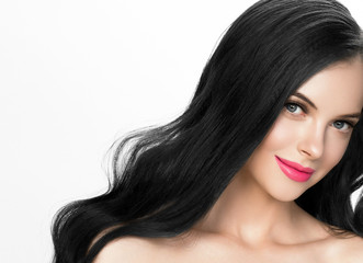 Brunette woman with long black hair and pink lipstick lips, female with beautiful eyes with lash extensions 