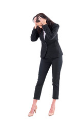 Worried business woman with head in hands looking down searching for something lost. Full body isolated on white background. 