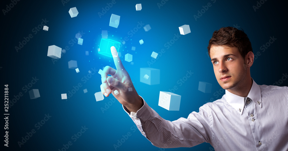 Aufkleber Man touching hologram screen displaying cube symbols
