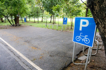 Empty parking bike or bicycle slot in public park garden.