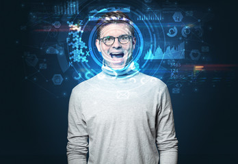 Facial recognition system. Young man on dark background, face recognition concept