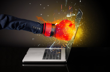 Firing hand hitting strongly laptop screen glass
