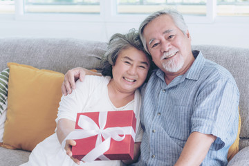 Happy love Elderly couple smiling Happy to receive surprise gifts, Senior couple old man and senior...
