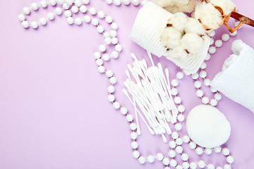 Branch of cotton plant, eared sticks, cotton pads,