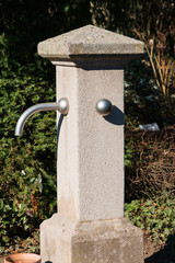 Concrete pillar Water dispenser in a park