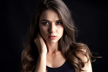 Fototapeta premium Portrait of a beautiful woman cute girl, Picture taken in studio on black background