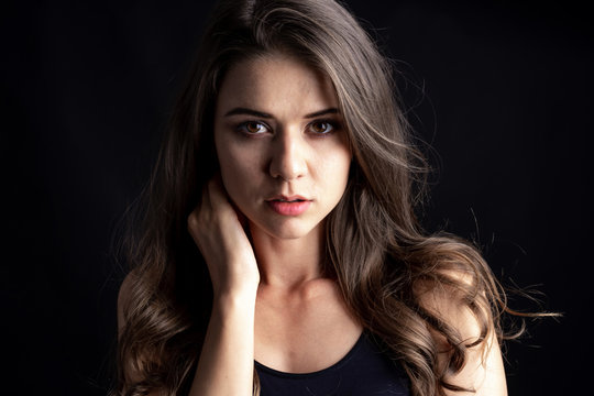 Portrait of a beautiful woman cute girl, Picture taken in studio on black background