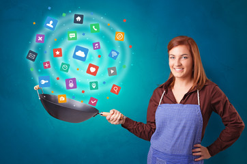 Young happy person cooking applications in wok

