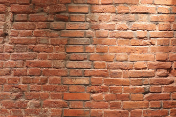 Old red brick texture with bricks of different sizes
