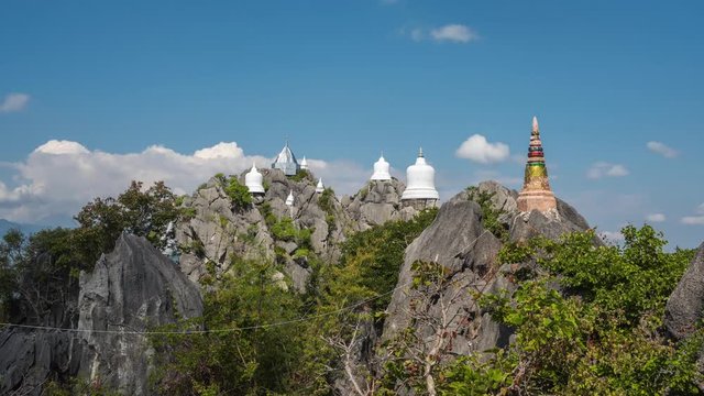 Time lapse of the Wat Phaphutthabat Phuphadaeng (Wat Chalermprakiat). A buddhist temple with small white pagoda built on high mountain in Chae Hom district, Lampang, Thailand