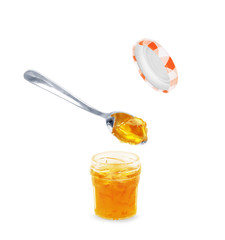 Spoon with tasty apricot jam on white background © vadarshop