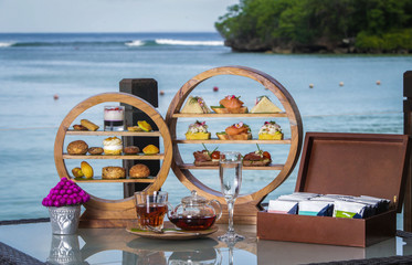 Afternoon tea ceremony, beach restaurant with sea view, delicious deserts and sweets