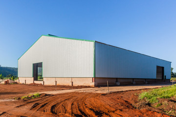 New Warehouse Barn Building Close-Up Metal Sheet Structure Rural Farming Landscape Blue Sky