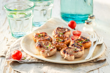 Hot grilled and twisted sausage with herbs and spices