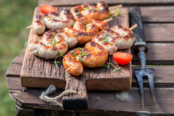 Spicy grilled and twisted sausage with spices and herbs