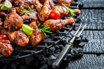 Tasty grilled chicken leg with lime and cherry tomatoes