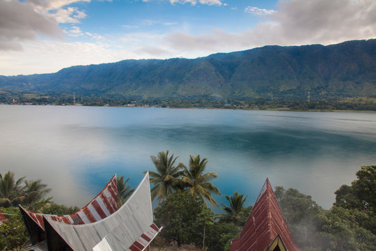 Typical Batak houses overlooking Lake Toba, Tuk Tuk, Lake Toba, Samosir Island, Sumatra, Indonesia