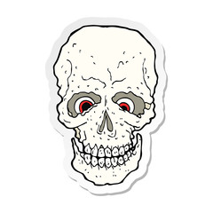 sticker of a cartoon spooky skull