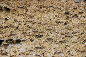 Old stone wall background texture close up