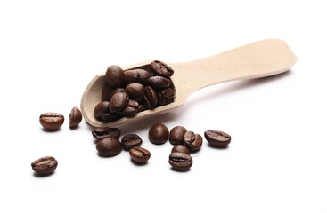 Coffee beans with wooden spoon isolated on white background