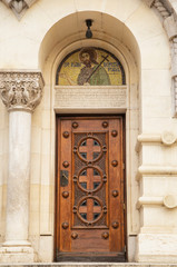 Ancient painted wooden door with ornaments