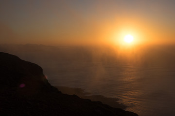 Obraz premium Panoramic view from the Mirador del Rio in Lanzarote during sunset with the island of La Graciosa