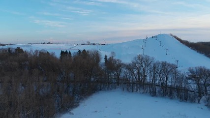 Snow park in Wisconsin, winter activities (tubing, skiing, snowboarding). Drone shots , bird's eyes view