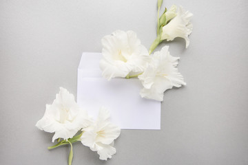 Closeup of letter with white flowers. Beautiful composition with letter and white flowers for March 8, International Womens Day, Birthday , Valentines Day or Mothers day