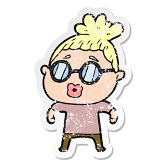 distressed sticker of a cartoon woman wearing spectacles