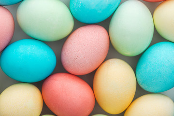 Fototapeta na wymiar top view of traditional pastel easter eggs on grey