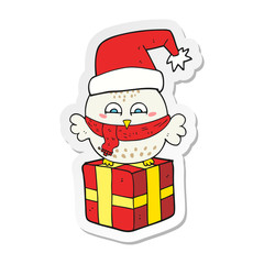 sticker of a cartoon cute christmas owl on gift
