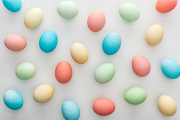 Top view of easter background with painted eggs isolated on grey
