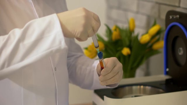 Vaccine against Covid. The doctor takes blood In Medical Laboratory