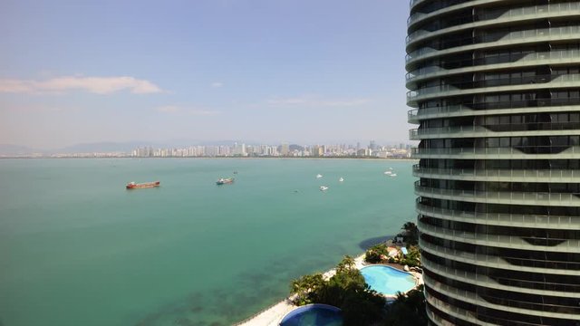 sunny day sanya bay famous hotel complex side rooftop panorama 4k timelapse hainan island china