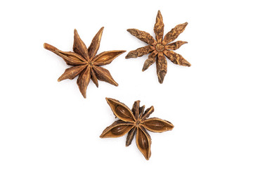 Group of three whole dry brown star anise fruit flatlay isolated on white background