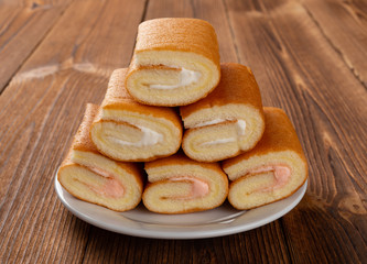 front view sweet rolls on a wood table